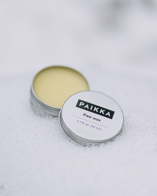 Paikka honey paw wax jar designed to protect dog paw pads from hot pavement and rough urban surfaces