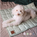 Dog resting on Komu Yuen bamboo cooling mat 