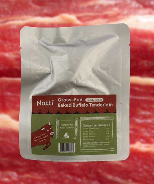 Single 20g sachet of Notti Grass-Fed Baked Buffalo Tenderloin with ingredient and guaranteed analysis label
