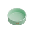 Notti Living 001 ceramic pet food bowl in Mint, a soft green bowl with orange Notti Living logo